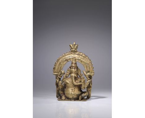 BronzeNepal , 18th centuryDimensions: Height 11 cm Wide 8 cm Depth 3 cmWeight: 277 gramsSeated Ganesha on small surface with 