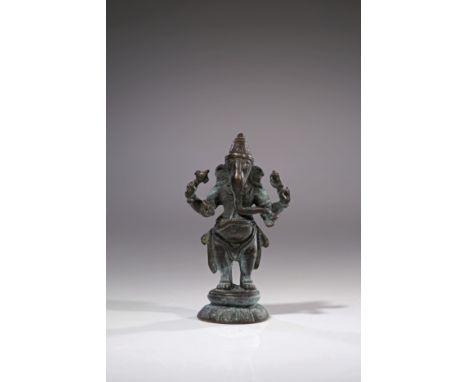 BronzeIndia , 18th centuryDimensions: Height 7 cm Wide 4 cm Depth 2cmWeight: 95 gramsSmall statue of standing Ganesha on roun