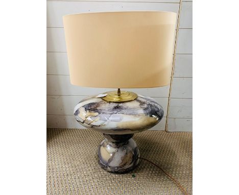 A mottled design table lamp with cream shade 