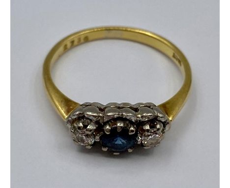 An 18ct three stone ring (3.7g) Size P