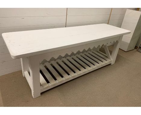 A long wooden table possibly a potting table with shelf under (H70cm W202cm D62cm)