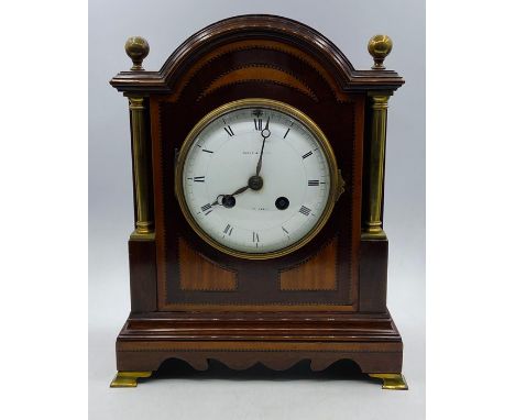 An Eight Day Maple &amp; Co mantle clock in mahogany.