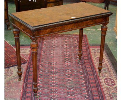 A Victorian walnut rectangular card table, in Louis XVI style, folding crossbanded top enclosing an inset baize lined playing