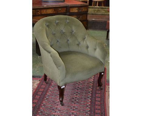 A Victorian button back tub chair, French cabriole forelegs, ceramic casters.