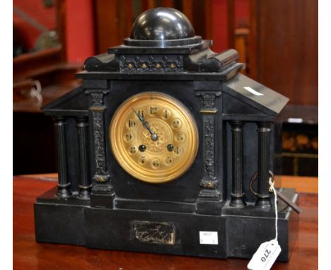 A black slate mantel clock by Japy Freres, late 19th Century, domed pediment, Doric columns, brass dial, Arabic numerals, key