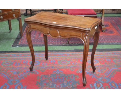 A 19th century mahogany serpentine card table, folding top enclosing an inset leather playing surface, above a deep frieze, s