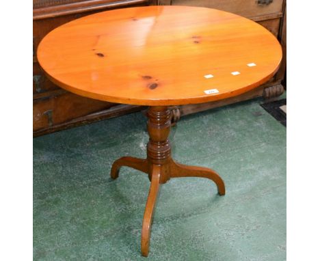 A George III tilt top tripod table, light oak turned column, associated circular pine top. 72.5cm high x 82cm diameter.