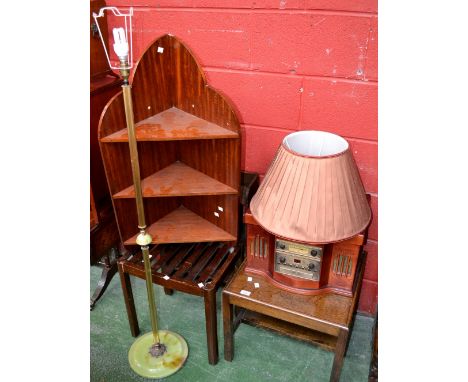 A suitcase stand; a standard lamp; an oak bookcase; an oak occasional table; a mahogany wall hanging corner shelf; a Classic 