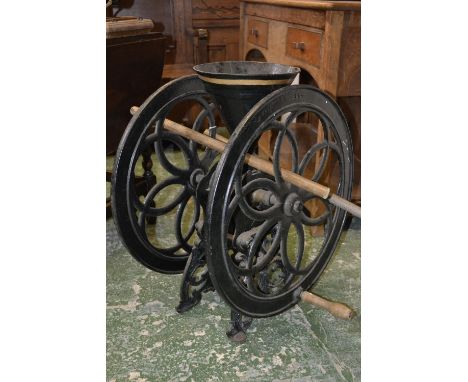 A cast iron maize/corn grinder, 24 inch wheel