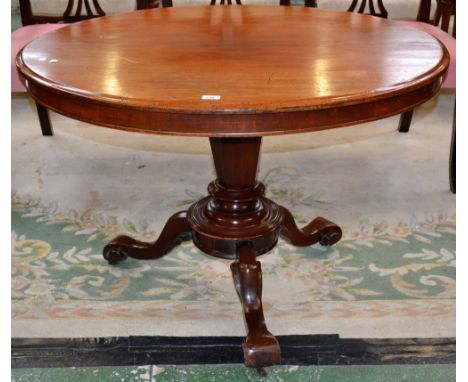 A Victorian mahogany breakfast table, oval top, cockbeaded frieze, tapering octagonal column, circular stepped socle, three c