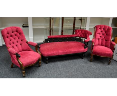 A Victorian chaise, button upholstered back rest, padded arm rail, spindled back, stuffed over seat, turned legs, ceramic cas