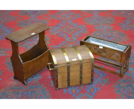 An oak domed top brass mounted small trunk/log box; an oak magazine rack; an oak planter. (3)