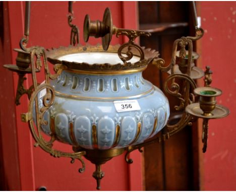 A hanging pottery/brass lamp