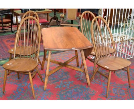 An Ercol drop leaf table and four high back chairs 