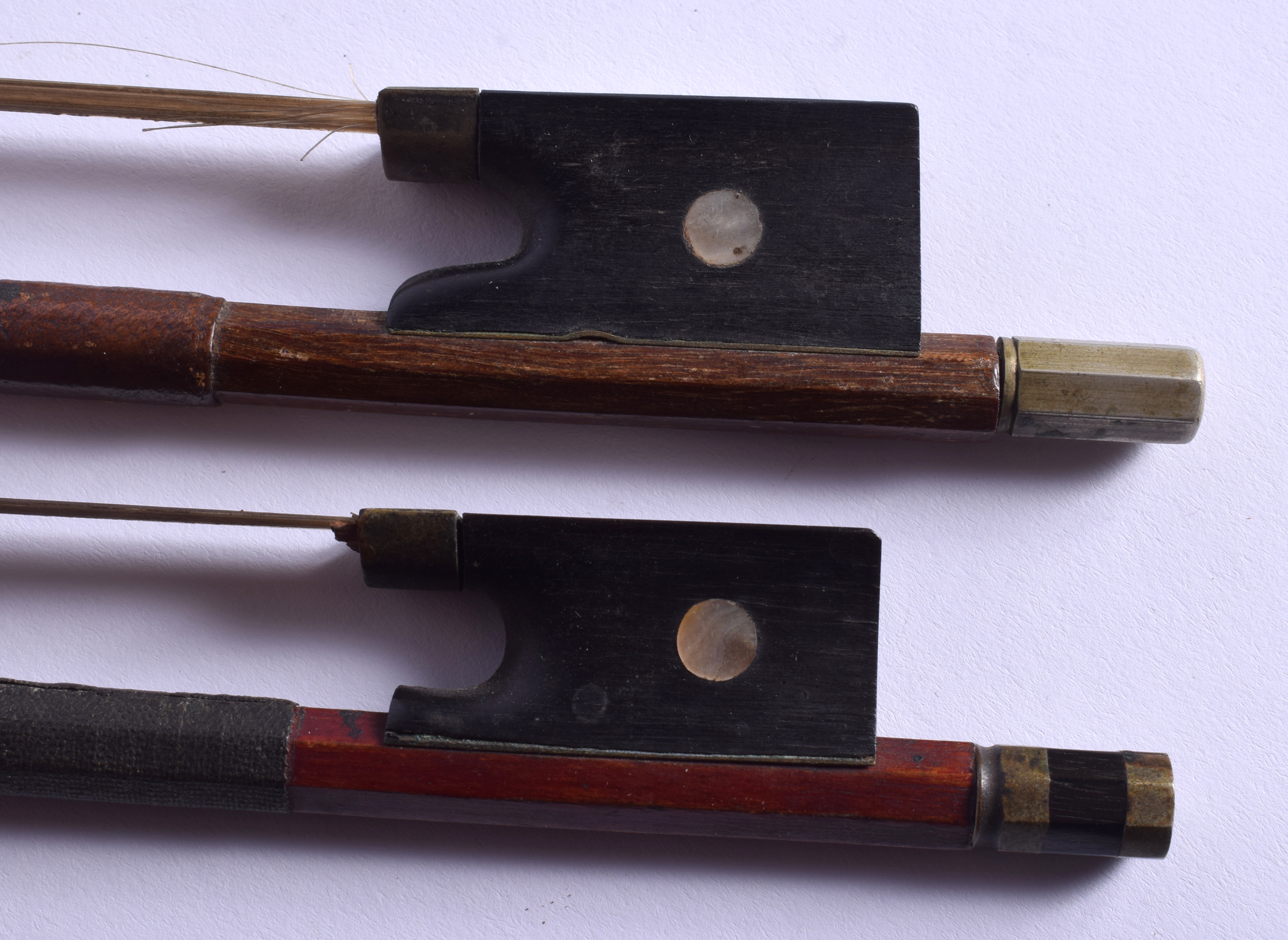 TWO VINTAGE VIOLIN BOWS. 70 cm long. (2)