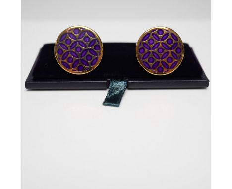 Pair of Halcyon Days enamel cufflinks featuring a striking purple geometric pattern on a gold-tone setting. These round cuffl
