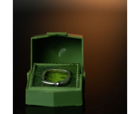 Unique sterling silver ring Sz.7 featuring a distinctive square-shaped band, adding a modern geometric appeal. The ring is se