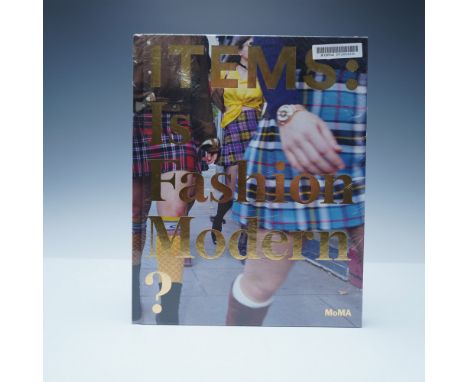 This hardcover book, Items: Is Fashion Modern?, published by the Museum of Modern Art (MoMA), explores the cultural and histo