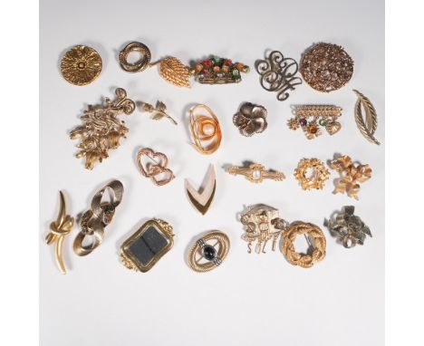 A charming collection of 24 vintage gold-tone brooches featuring an array of intricate designs, from floral and filigree moti