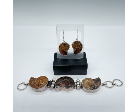 This set includes a bracelet and a matching pair of earrings featuring fossil ammonite designs. The bracelet is marked 925, c