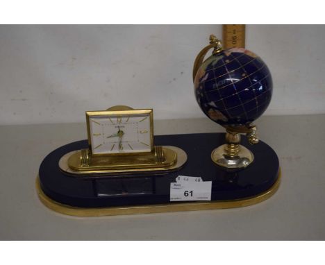 A modern desk clock with globe mount