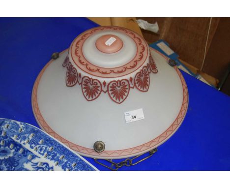 An opaque glass light shade with geometric pattern