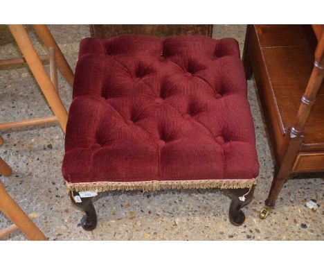 A button upholstered footstool
