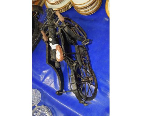 Small iron model cannon together with a model motorbike