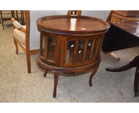 Reproduction hardwood drinks cabinet of oval form with lift off tray top