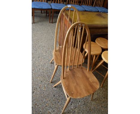 A pair of Ercol light elm stick back dining chairs