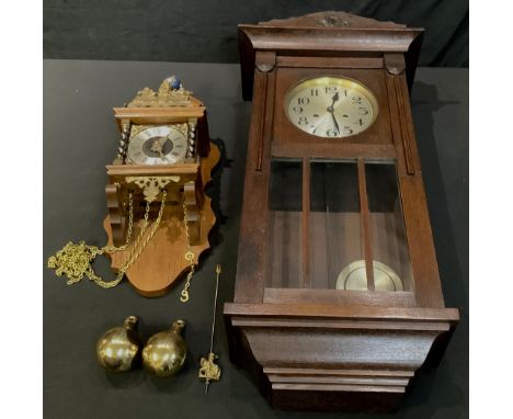 A Dutch Franz Hermle 'Atlas' wall clock; another, oak wall clock, c.1930 (2) 