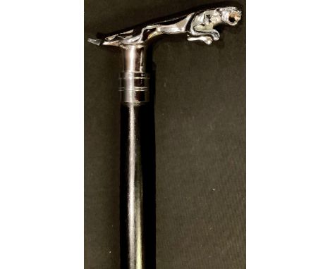 An ebonised walking stick, the handle as a Jaguar car mascot 