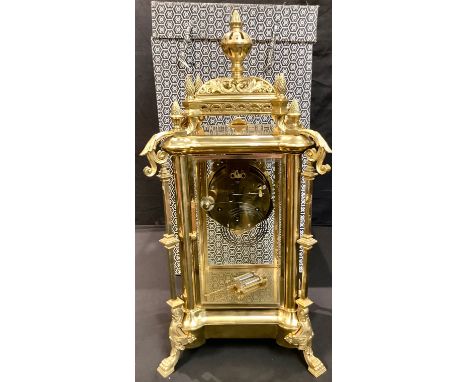 A large French style gilt metal mantel clock, the 12cm enamel dial with twin winding holes, "mercury" pendulum, pierced domed
