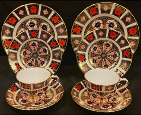 A pair of Royal Crown Derby Imari palette 1128 pattern teacups, saucers, tea plates and side plates, first quality 