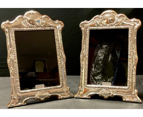 A pair of contemporary Art Nouveau style silver photograph frames, wooden easel backs, London 2022, 21cm high (2) 