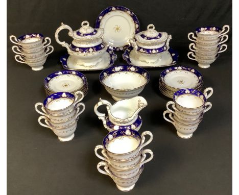 A mid 19th century Staffordshire part tea service comprising cake plates, sucrier, slop bowl, cream jug, cups and saucers; an