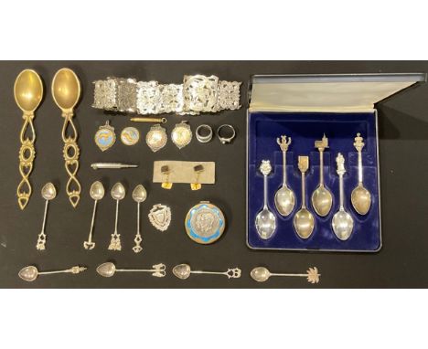 An early 20th century EPNS nurse's belt, engraved with orchids; a set of six EPNS wedding spoons, cased; a silver fob, Birmin