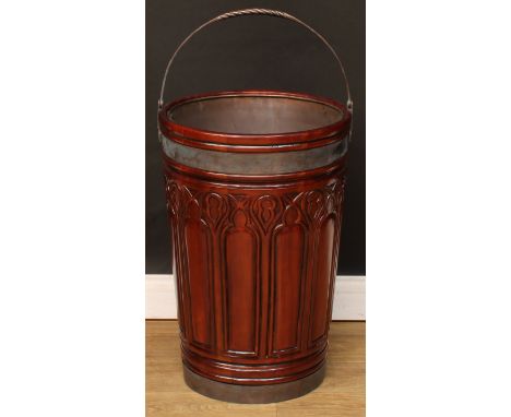 A substantial Victorian style mahogany fireside peat bucket or log bin, in the Irish Gothic Revival taste, the exterior with 