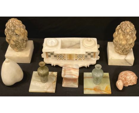 A pair of 19th century carved marble pineapples, square marble bases, 15cm high; an alabaster ink stand; a pair of miniature 