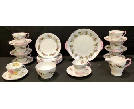 A Shelley tea service for six, decorated with blossom and fruit, comprising cake plate, cream jug, sugar bowl, side plates, c