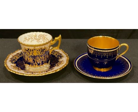 A Royal Worcester cabinet coffee cup and saucer, the cobalt ground heavily gilded, printed mark in puce; a Coalport cabinet c