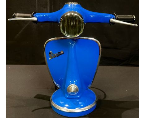 A novelty table lamp, modelled as a Vespa handlebar and front panel, 33.5cm high, 41cm wide 