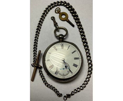 A George V silver open face pocket watch, white enamel dial with Roman numerals, subsidiary seconds dial, Chester 1943, a sil