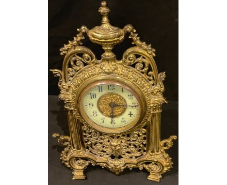 An early 20th century brass Rococo style strutt clock, 34cm high 