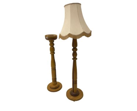 Hardwood standard lamp, ring turned column on circular base, with shade (H136cm); and matching jardinier or candle stand (H97