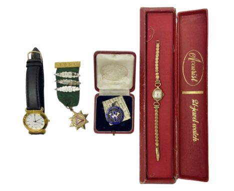 Ladies Accurist 9ct gold manual wind wristwatch, on gilt metal bracelet, together with a silver and enamel fob, for the Trans