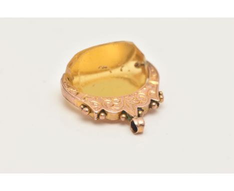 A LATE VICTORIAN 9CT GOLD CITRINE SWIVEL FOB, faceted Citrine stone fitted with a foliate pattern surmount with applied bead 