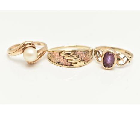 THREE 9CT GOLD RINGS, the first set with an oval cut amethyst, open work heart detailed shoulders, hallmarked 9ct Birmingham,