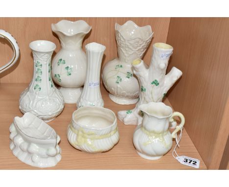 A COLLECTION OF BELLEEK PORCELAIN, comprising a cream jug and sugar bowl, with gold seventh mark, a shamrock tree trunk vase,