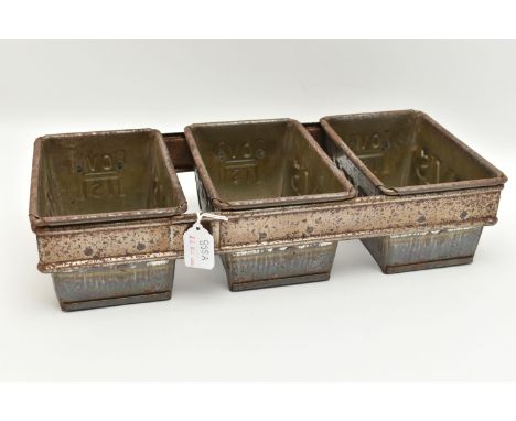 A SET THREE HOVIS BREAD TINS, the three tins joined together with a tin brace, approximate dimentions of each tin 17cm x 12cm